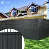 A black fence made of privacy strips is installed in front of a house. Produktbild-Vorschau