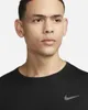 Close-up of a man wearing a black Nike t-shirt. Podgląd zdjęcia produktu