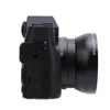 Side view of a black digital camera with lens attached. Podgląd zdjęcia produktu
