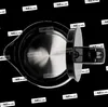 Top view of a black electric kettle with its lid open, showing the metallic interior. Produktbild-Vorschau