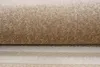 A close-up view of a rolled-up carpet, showing its texture and weave. Produktbild-Vorschau