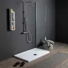 A modern bathroom with a shower tray, shower fixture, and a shelf. Anteprima dell’immagine prodotto
