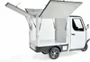A white three-wheeled cargo vehicle with its cargo bay doors open, shown from a rear-quarter angle against a white background. Produktbild-Vorschau