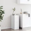 A white apothecary cabinet and a white kitchen cabinet are shown in a room with light gray walls and light wooden floors. Anteprima dell’immagine prodotto