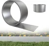 A metal garden edging product is shown in a roll and a formed circle, with a blurred background of flowers and grass. Náhled obrázku produktu