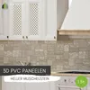 A kitchen backsplash with stone-like PVC panels, white cabinets, and a range hood. Produktbild-Vorschau