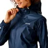 A woman wearing a navy blue rain jacket. Produktbild-Vorschau