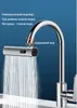 A close-up of a kitchen faucet with water spraying from the showerhead, highlighting its features. Produktbild-Vorschau