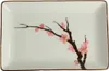 A rectangular plate with a painted cherry blossom branch. Produktbild-Vorschau