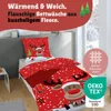 A bed with Christmas-themed bedding featuring a reindeer. Produktbild-Vorschau