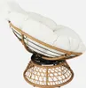 A papasan chair with a white cushion on a white background. Produktbild-Vorschau