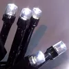Close-up of several white LED lights on black wires. Produktbild-Vorschau