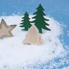 Decorative Christmas trees and a star are placed on artificial snow against a blue background. Produktbild-Vorschau