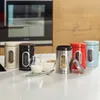 A set of five food storage canisters with clear windows, arranged on a white countertop in a kitchen setting. Produktbild-Vorschau