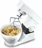 A white Kenwood stand mixer with a mixing bowl containing dough. Produktbild-Vorschau