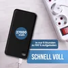 A black power bank is shown charging next to a white power strip. Voir les images du produit