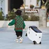 A child is pulling a panda-shaped suitcase while walking on a paved surface. Produktbild-Vorschau