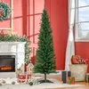 A Christmas tree stands in a room decorated for the holidays, with a fireplace and gifts. Produktbild-Vorschau