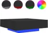 A 3D rendering of a black couch table with a blue base, shown with small circular insets displaying different color options and a color wheel. Produktbild-Vorschau