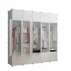 A white modular wardrobe with several compartments, some open to reveal clothes hanging on hangers and folded items on shelves. Náhľad obrázku produktu