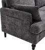 Close-up view of the armrest and side of a dark gray sofa. Produktbild-Vorschau