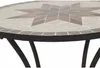 A close-up view of a mosaic table top with a star pattern. Produktbild-Vorschau