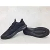 A pair of black Adidas sports shoes are displayed on a light gray surface. Produktbild-Vorschau
