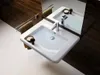 A modern bathroom sink with a chrome faucet and a towel rack with a towel. Podgląd zdjęcia produktu