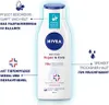 A Nivea body lotion bottle with marketing text and icons. Voir les images du produit