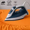 An iron is shown on an orange fabric, likely a bedsheet, with icons and text indicating product features. Produktbild-Vorschau