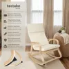 A rocking chair with descriptive text on the left side, set in a room with curtains and a side table. Náhled obrázku produktu