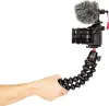 A hand holding a flexible tripod with a camera and microphone attached. Produktbild-Vorschau