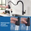 A kitchen faucet with a pull-down sprayer is shown in use, with a hand demonstrating two spray functions. Produktbild-Vorschau