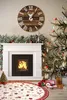 A festive Christmas scene with a fireplace, Christmas tree, and decorations. Podgląd zdjęcia produktu