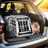 A dog is sitting next to a dog crate in the trunk of a car. Náhled obrázku produktu