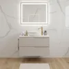 A modern bathroom vanity with a sink and faucet, set against a marble-tiled wall. Produktbild-Vorschau