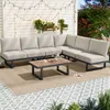 An outdoor patio setting with a sectional sofa and coffee table. Anteprima dell’immagine prodotto