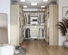 A modern walk-in closet with light wood cabinetry and organized clothing. Produktbild-Vorschau