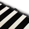 A close-up view of the wooden slats and black metal frame of a bed base. Náhľad obrázku produktu