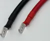 Close-up view of two battery cables with ring terminals. Produktbild-Vorschau