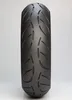 A close-up, front-facing view of a motorcycle tire on a white background. Náhled obrázku produktu