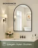 A bathroom vanity with a large arched mirror, sink, faucet, and decorative elements. Produktbild-Vorschau