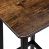 A close-up view of the corner of a wooden tabletop with black metal legs. Podgląd zdjęcia produktu