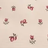 A repeating pattern of small, stylized roses on a striped background. Produktbild-Vorschau