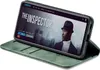A green flip case for a smartphone is shown open, displaying the phone's screen which shows a movie poster titled 'The Inspector'. Produktbild-Vorschau