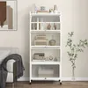 A white metal shelving unit with five shelves, some of which are transparent, is shown in a room with a sofa and a plant. Produktbild-Vorschau