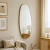A living room scene featuring a mirror, sofa, and cabinet. Podgląd zdjęcia produktu