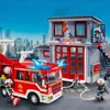 A Playmobil fire station and fire truck playset with figures. Produktbild-Vorschau