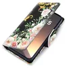 A floral patterned flip case for a smartphone is shown open, revealing the phone screen. Produktbild-Vorschau