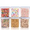 Six clear plastic food storage containers filled with various food items and candies, arranged in two rows of three. Produktbild-Vorschau